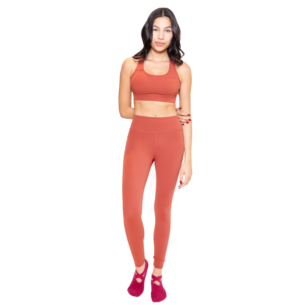 Full view of terracotta women's active wear – high-waist leggings and top